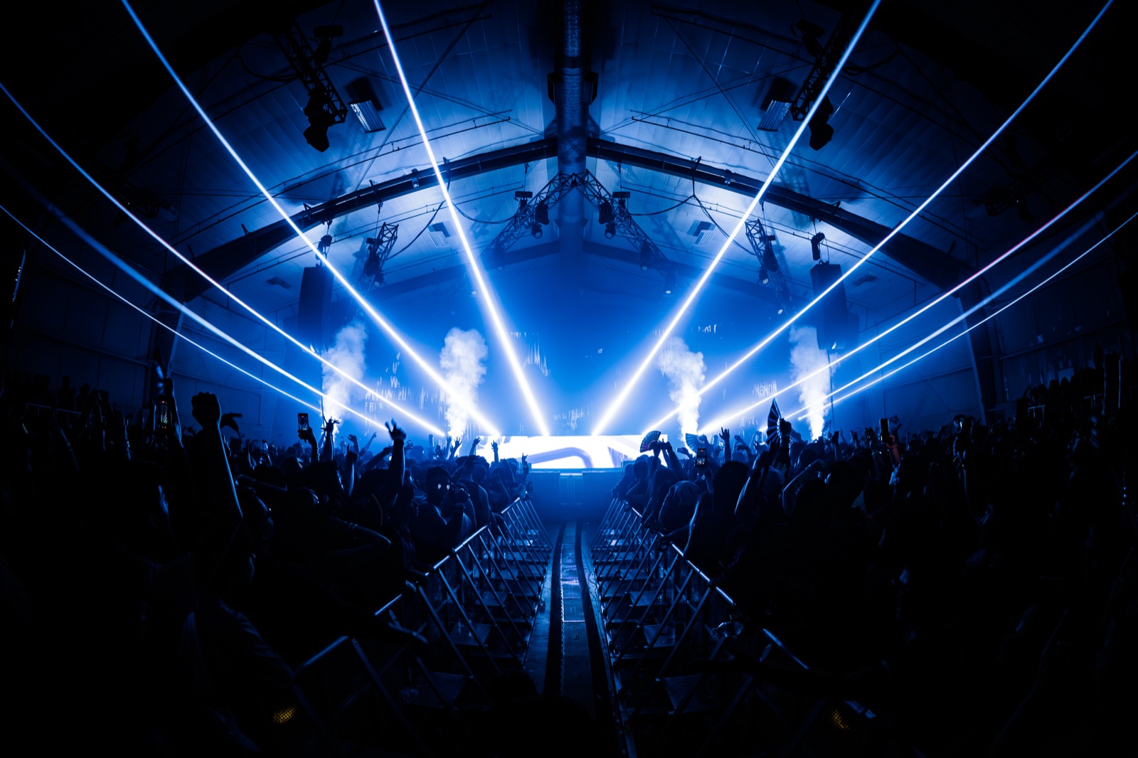 Lost in Dreams — blue lasers fanning out above the crowd toward the main stage