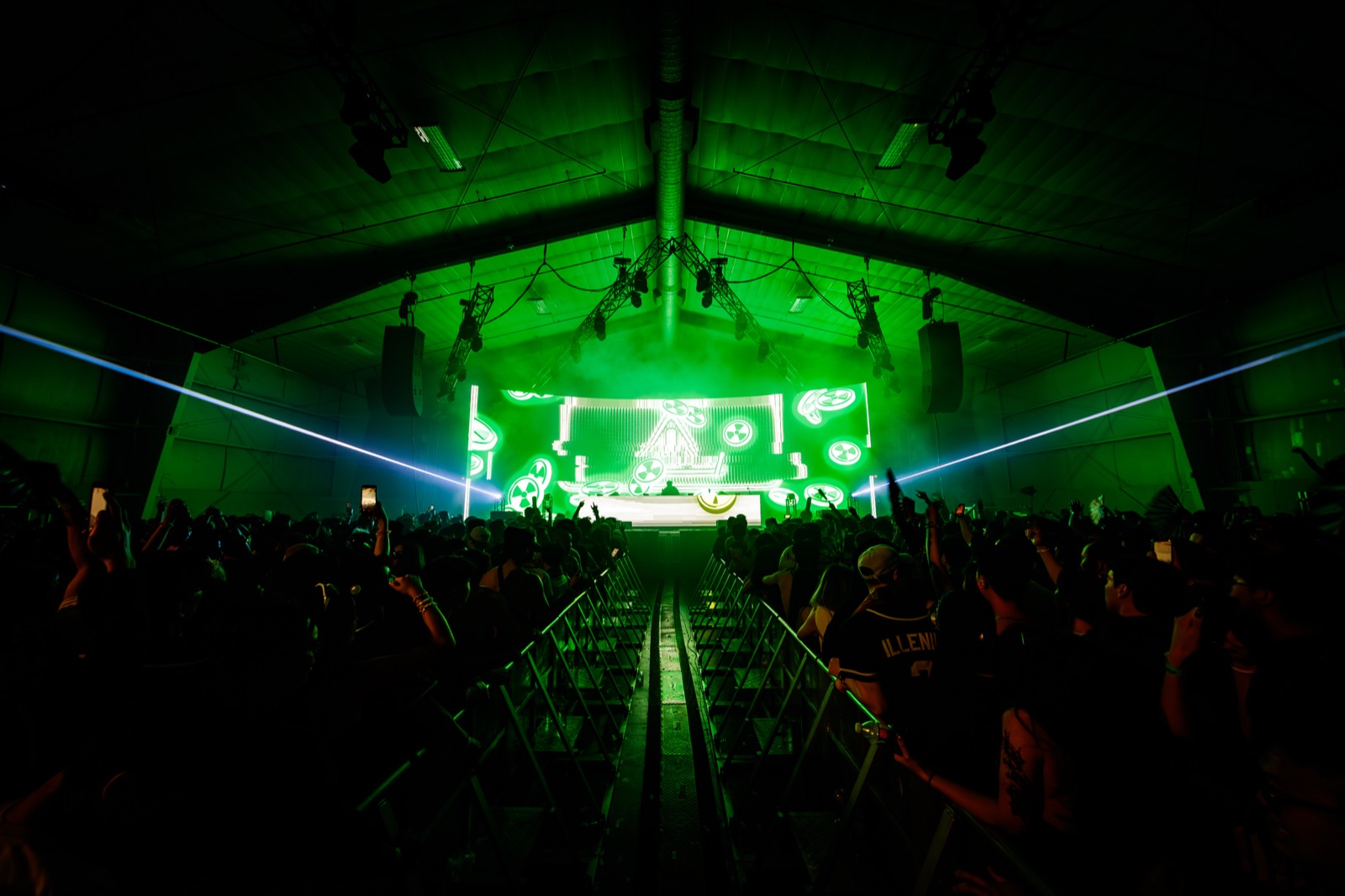 Lost in Dreams — the LED wall in green wash, seen from the front barrier
