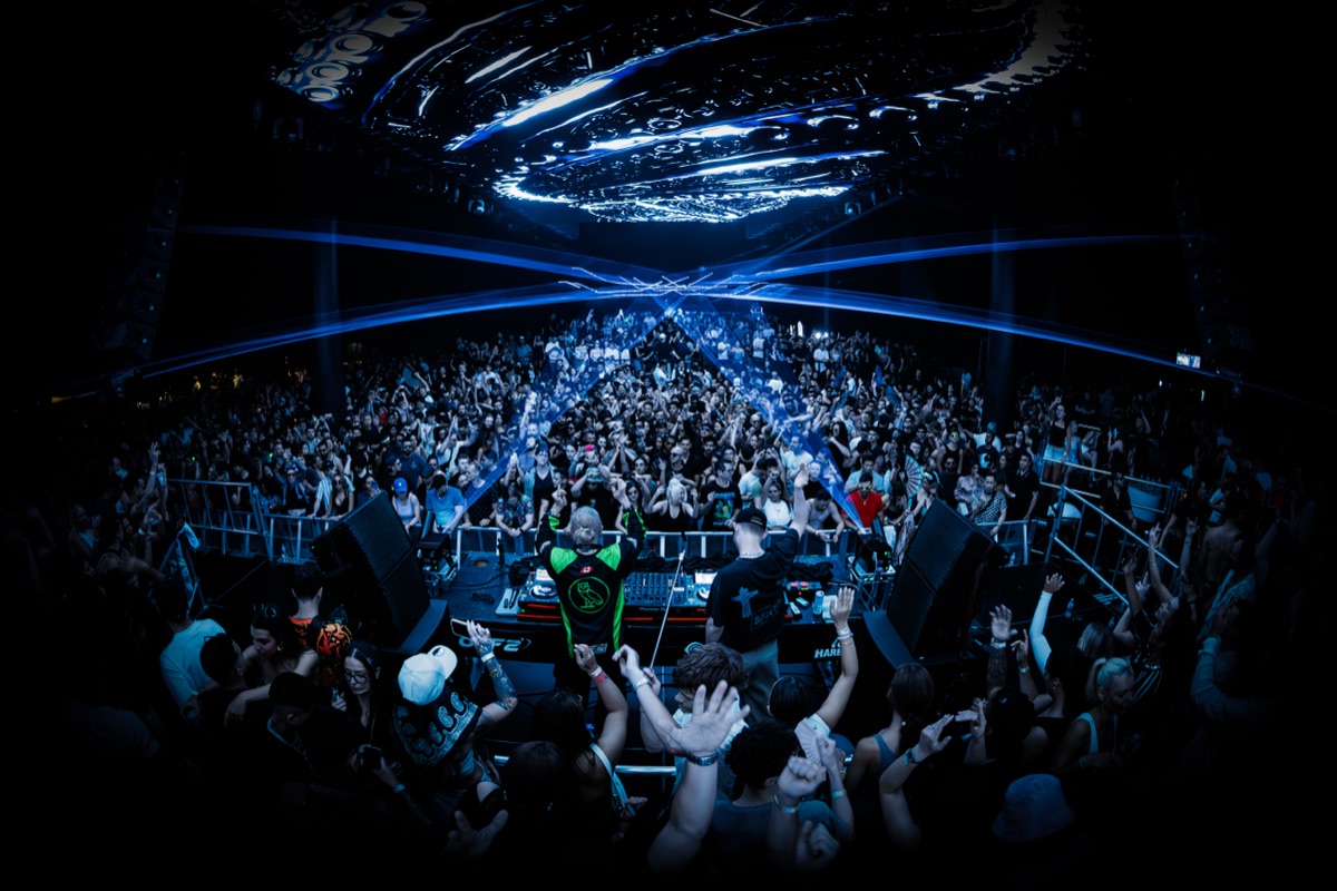 Harbour Event Centre — the floor from behind the DJ booth, blue lasers converging overhead