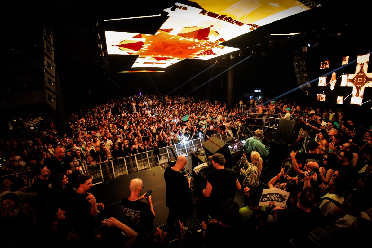 Harbour Event Centre — angled ceiling panels in warm orange over the crowd
