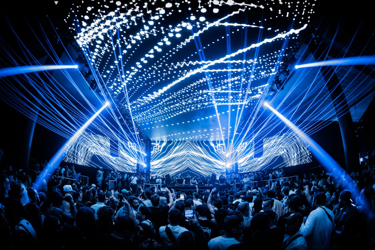 Harbour Event Centre — the main room under a blue beam array and full-width LED wall